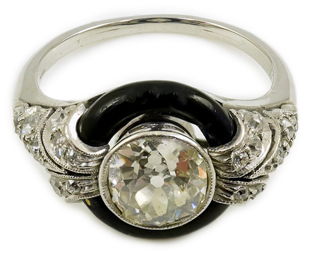 An Art Deco platinum black enamel and diamond set ring